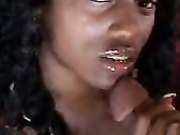 Gorgeous ebony babe sucking balls and tugging dick
