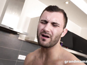 Blonde granny fucks young boy in the kitchen