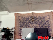 MILF with glasses rides her big cocked stepson on the bed