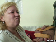 Busty 70 years old granny tastes his cock