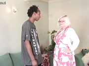 Busty British granny takes young black cock
