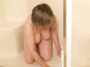 Sexy naked grandma cleans the shower again